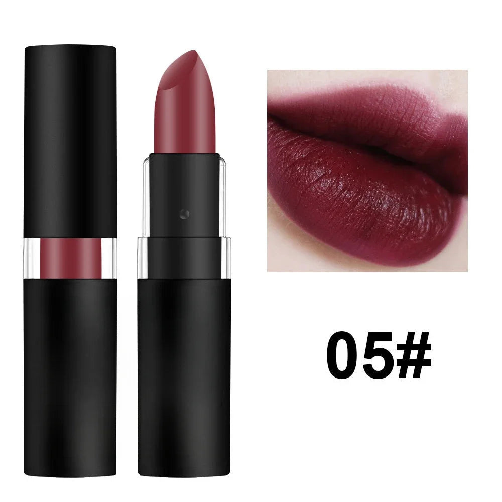 Dark wine red matte lipstick in black tube with waterproof, high-pigment swatch on lips. Long-lasting lip makeup.