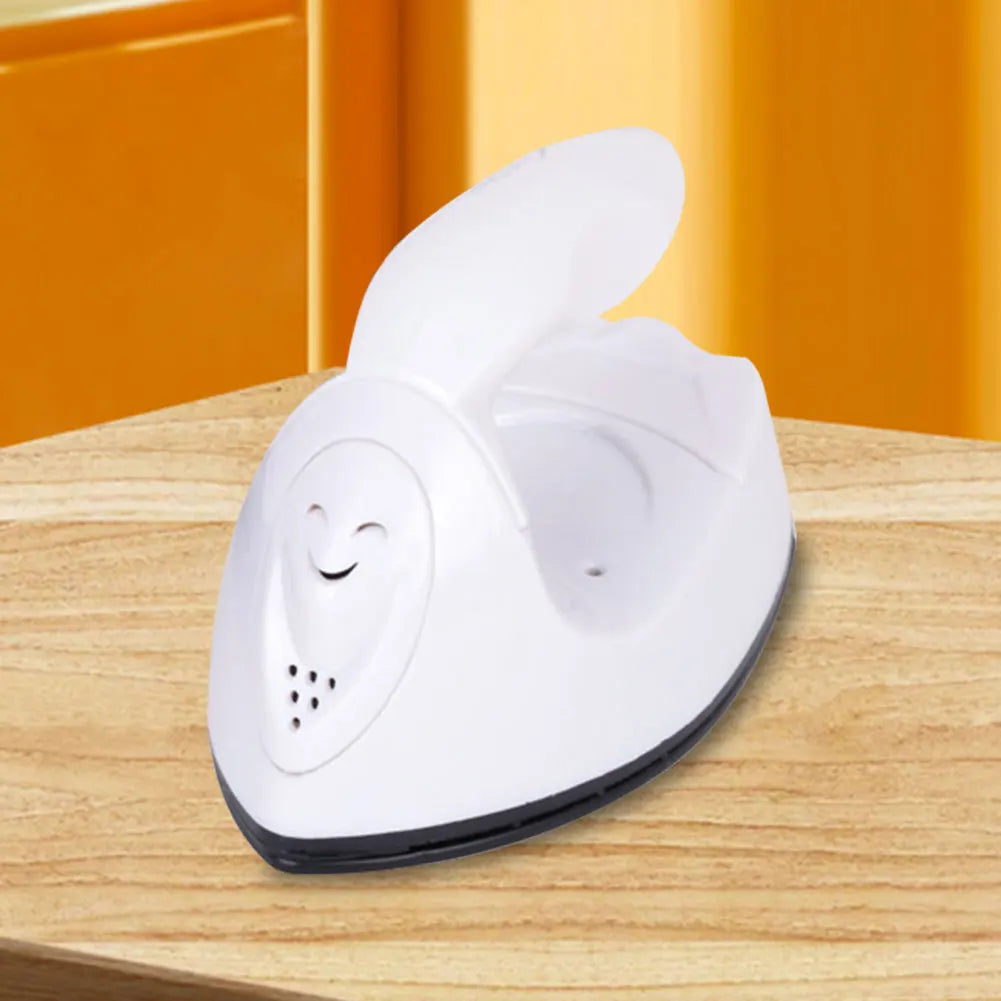 Tidesmit handheld mini iron showing ergonomic grip and heating plate for portable craft and sewing heat transfer