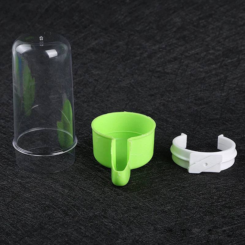 Automatic plastic bird water dispenser and food feeder bowl for parrot cages in clear and green for easy hydration.