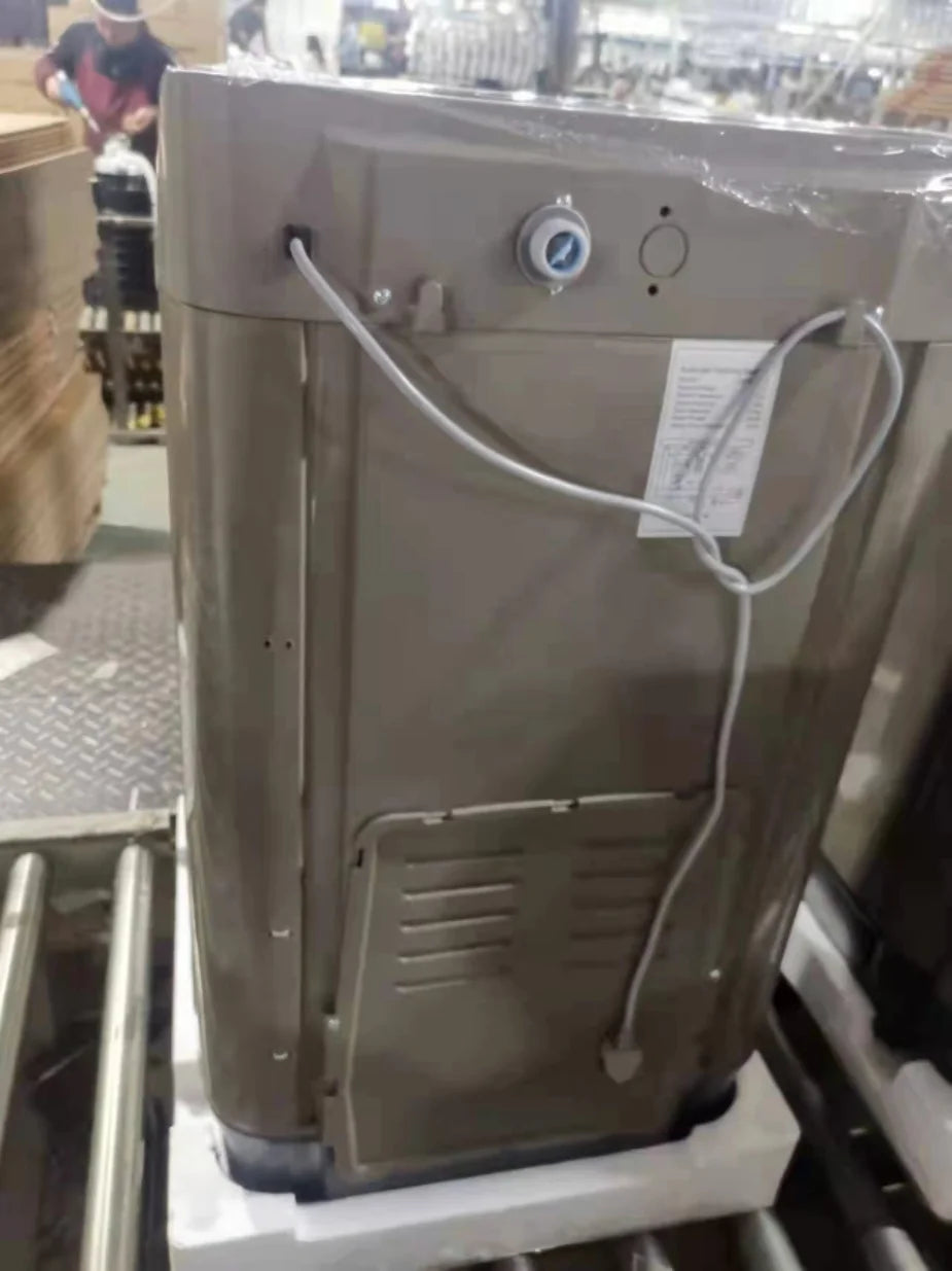 Tidesmit 12kg top load fully automatic washing machine, side view showing laundry drum and stainless steel interior.