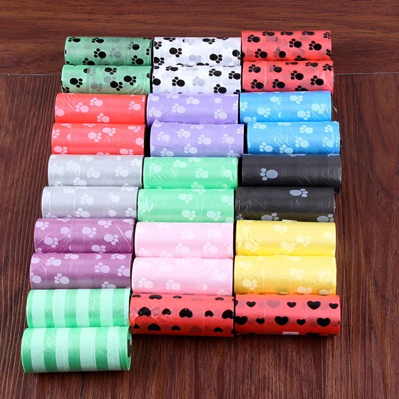 Multi-colored dog poop bags with paw prints, leak-proof and durable waste bags for easy pet cleanup.