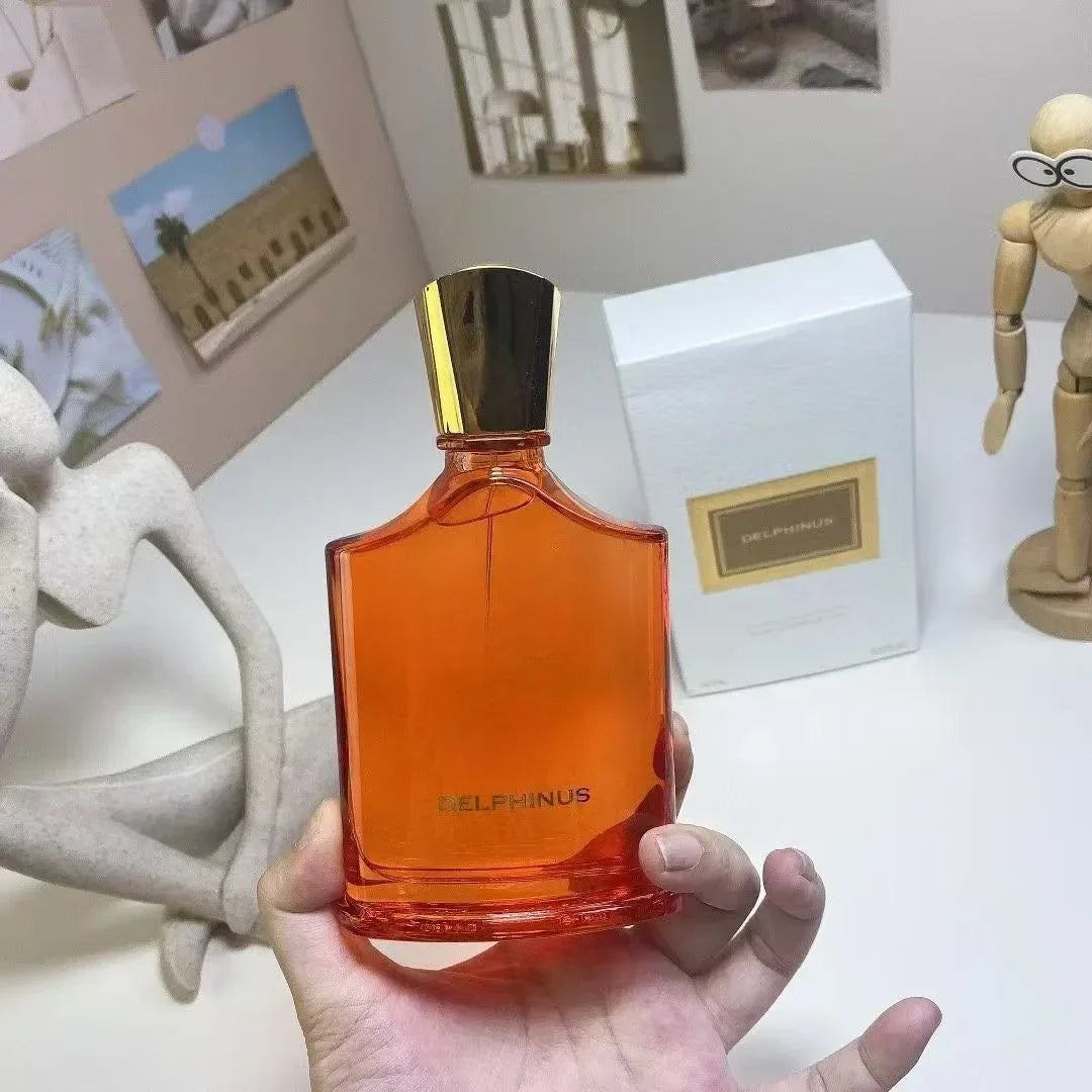 Delphinus 100ml fruity floral perfume for men and women, orange glass bottle with gold cap, luxury lasting cologne.