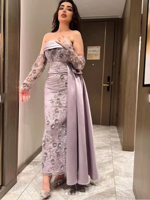 Tidesmit strapless lavender sheath prom dress with floral applique, sheer sleeves, and a draped side train.