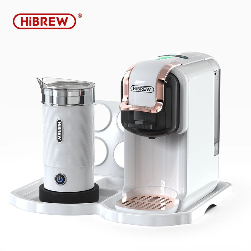 HiBREW white and rose gold capsule coffee machine with matching electric milk frother on a white storage tray.