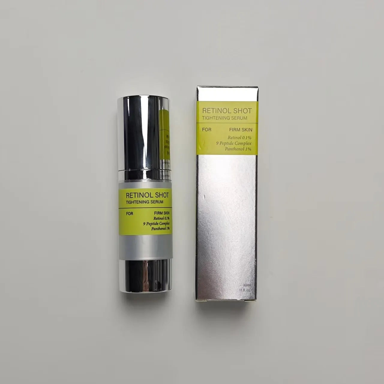 Retinol shot tightening serum bottle with outer box, silver and green label