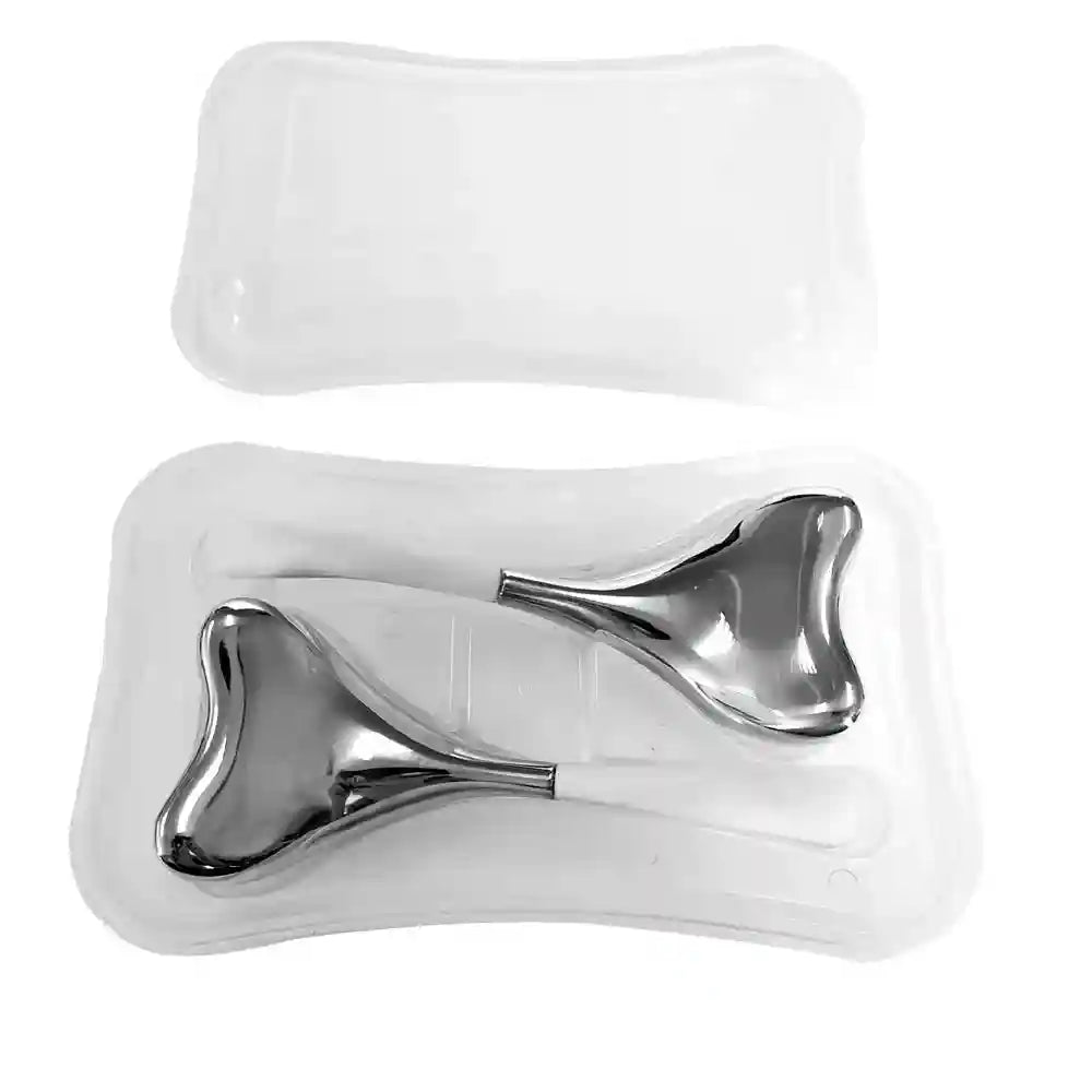 Two metallic silver, triangle-shaped facial cryo sticks with white handles, resting in a clear plastic storage case.