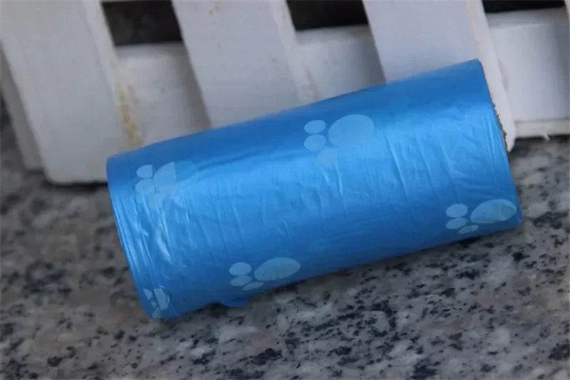 Blue leak-proof dog poop bags with cute cartoon paw prints for easy, mess-free pet waste disposal.