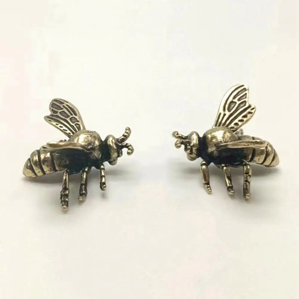 Solid brass bee tea pet figurine, realistic golden metal insect sculpture for desktop decor and desk accessory.