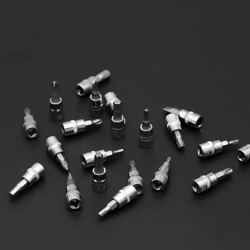 Assorted chrome sockets and drive bits in small round holders