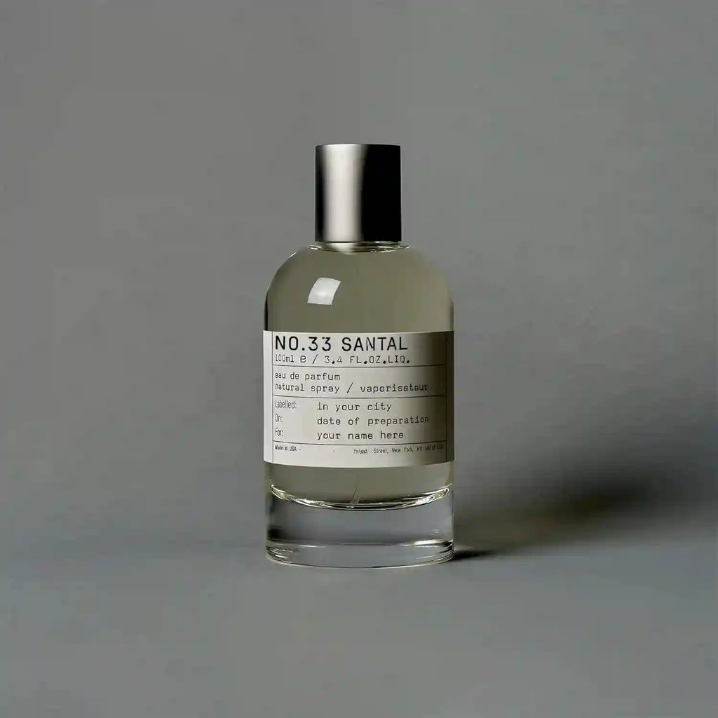 SantaleX No.33 Santal EDP: Unisex woody amber eau de parfum in a minimalist glass bottle with silver cap.