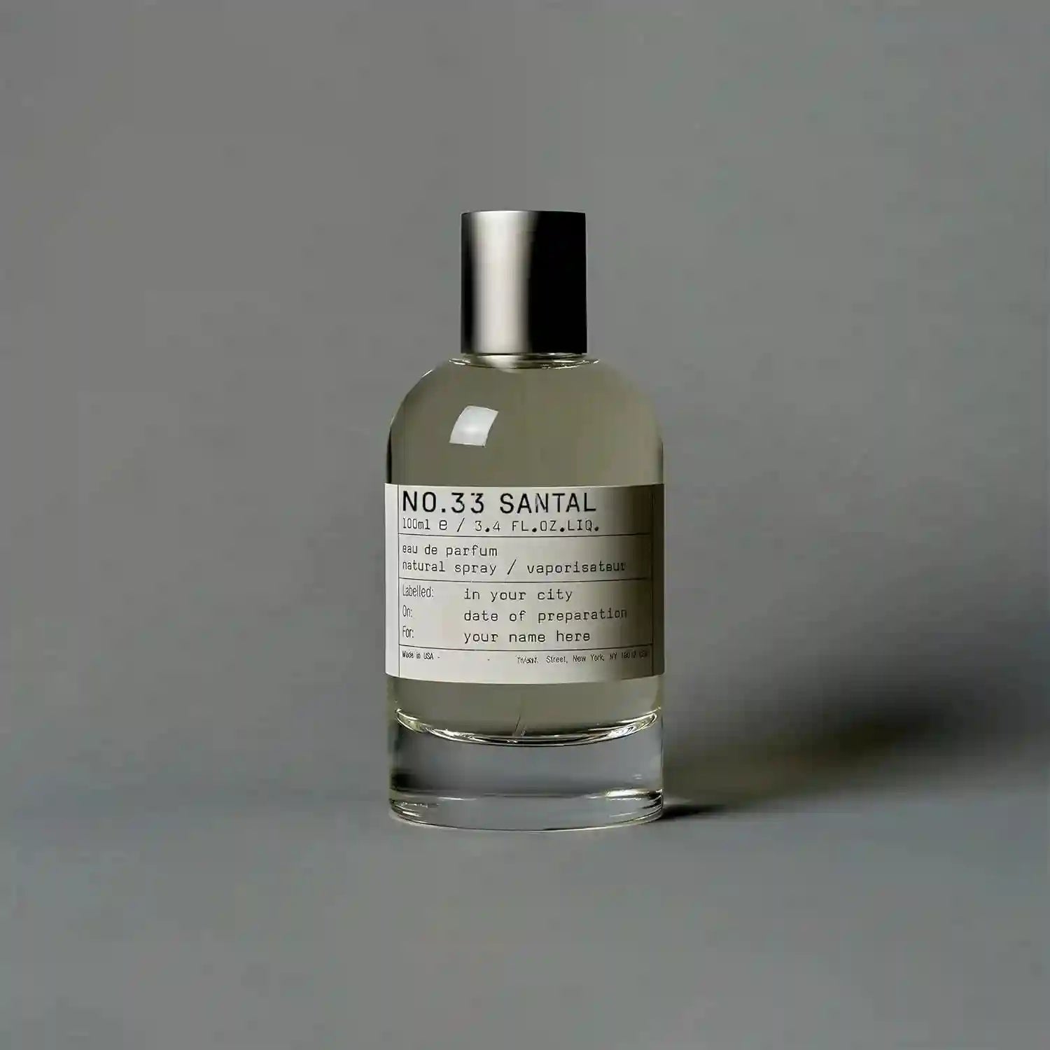 SantaleX No.33 Santal EDP: Unisex woody amber eau de parfum in a minimalist glass bottle with silver cap.