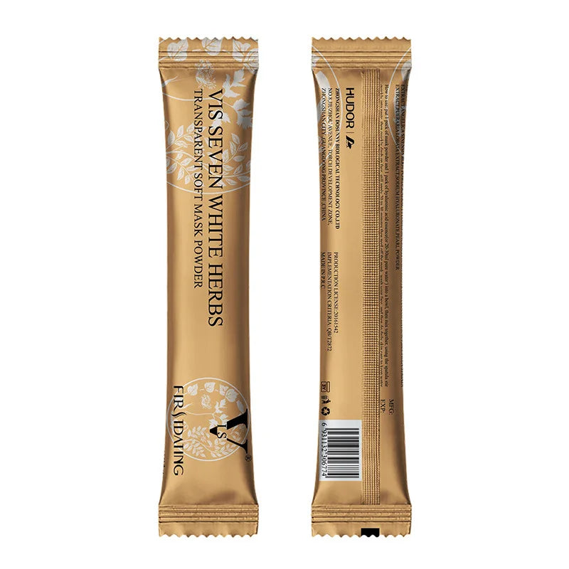 Two gold-colored, slim, vertical sachets of "Vis Seven White Herbs" powder mask, shown from the front and back.