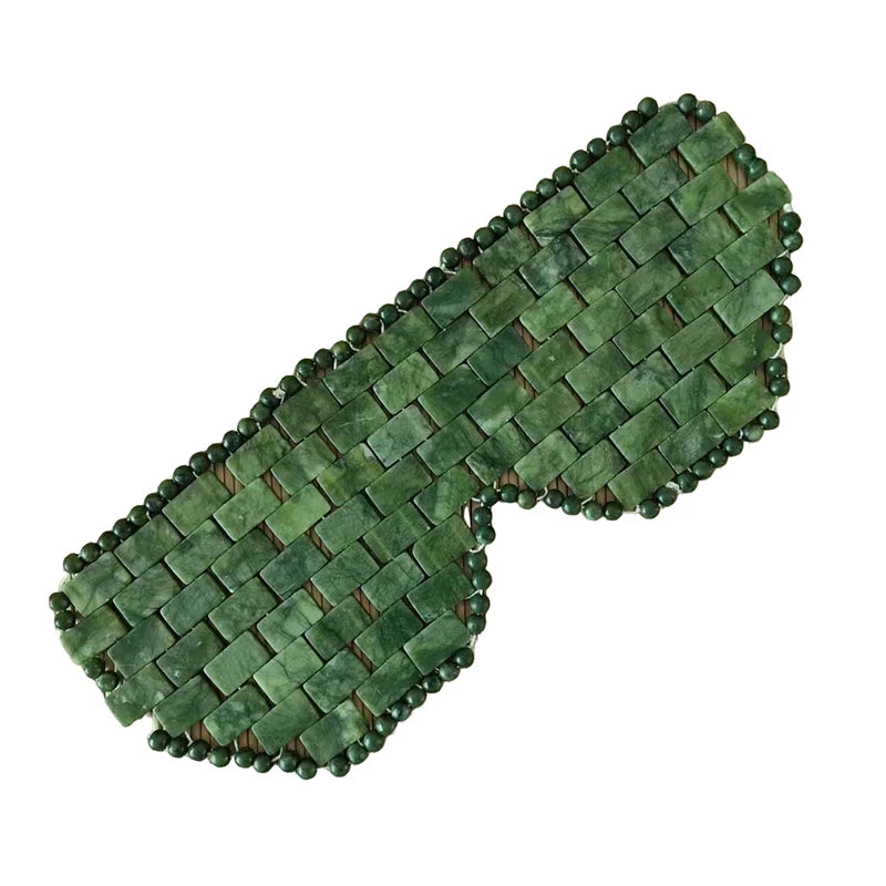 Natural green jade cooling eye mask made of connected stone tiles for facial relaxation and sleep therapy.