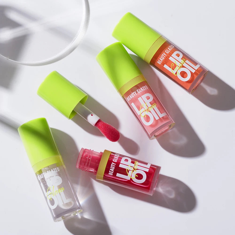 Moisturizing Beauty Glazed candy lip oil set with pearlescent lustrous mirror finish in colorful tubes.