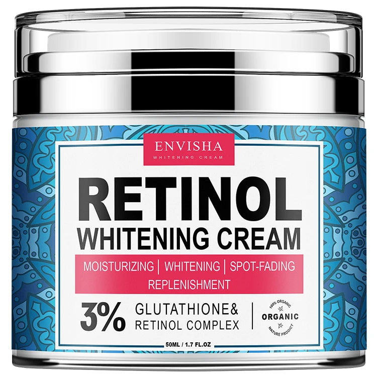 A jar of ENVISHA Retinol Whitening Cream with a blue patterned label, silver lid, and white text on a pink background.