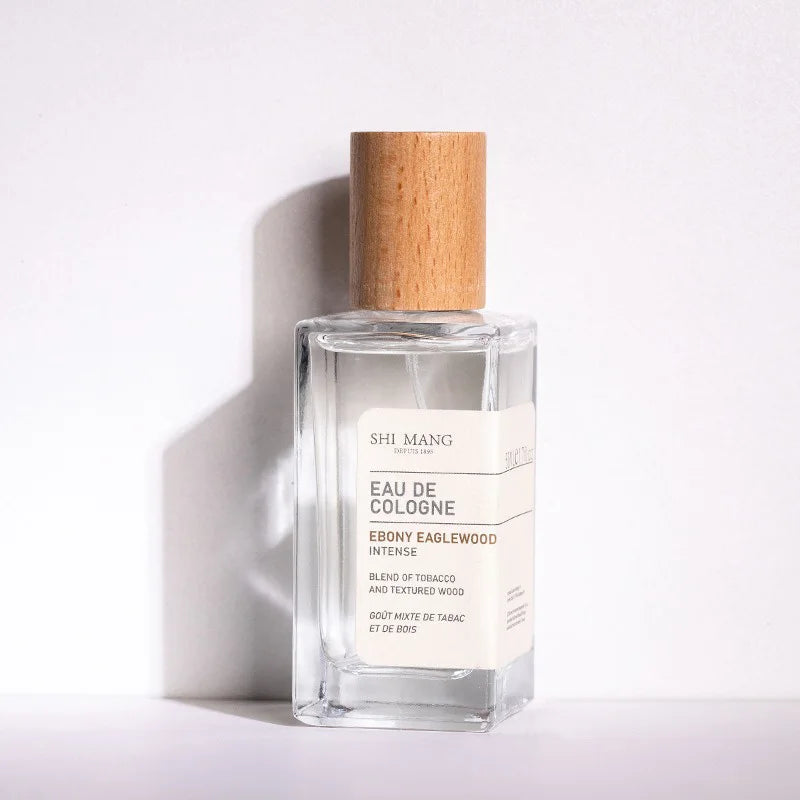 Shi Mang Ebony Eaglewood woody perfume in square glass bottle with wooden cap. Unisex tobacco & wood EDC fragrance.