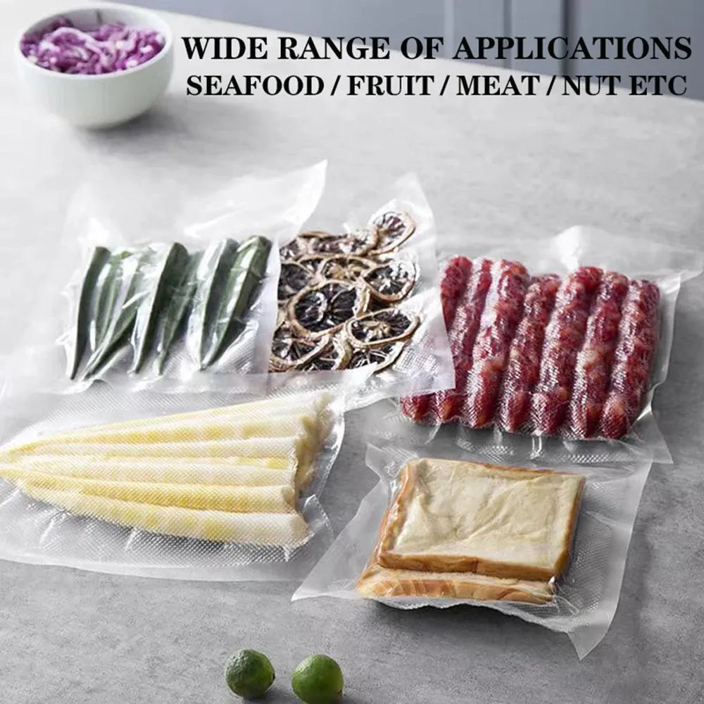 Assorted vacuum sealer bags with various food items inside
