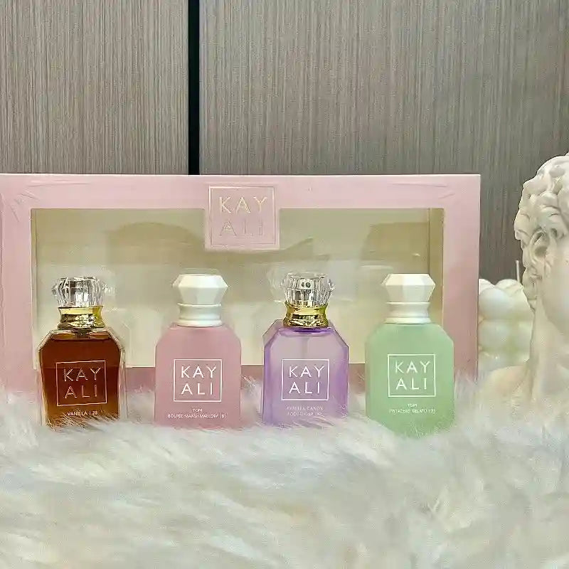 KAYALI 4x30ml unisex perfume gift set: sweet vanilla, marshmallow, and pistachio scents in iconic glass travel bottles.