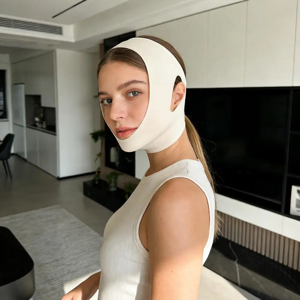 A woman wears a beige V-shaper face mask that lifts and tightens the chin and jawline area.