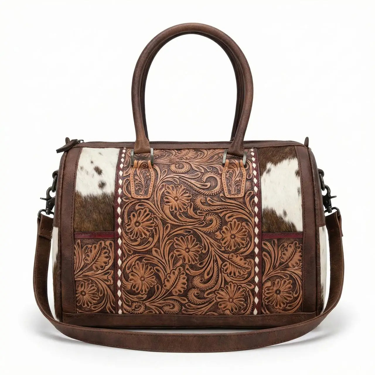 Brown genuine leather mini duffel with floral tooling, cowhide panels, top handles, and shoulder strap. Trunk style.