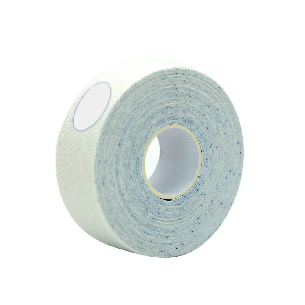 A roll of white, textured adhesive face tape with subtle blue flecks, viewed at an angle on a white background.