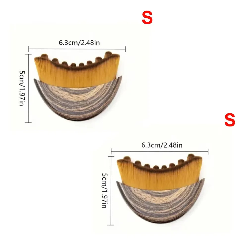 Two crescent-shaped face brushes with wood-grain handles and golden bristles, showing dimensions of 6.3cm by 5cm.