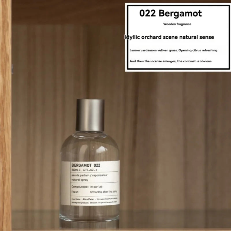 Bergamot 022 unisex Eau de Parfum: 100ml citrus-woody fragrance in a minimalist round glass bottle with silver cap.