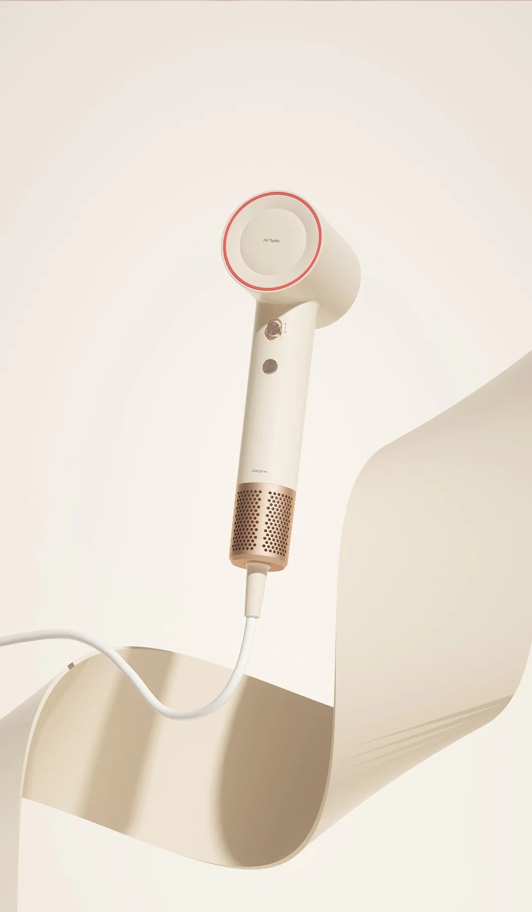 DOCO high-speed hair dryer in beige with gold handle, 110k RPM, negative ion care, modern design for fast drying.