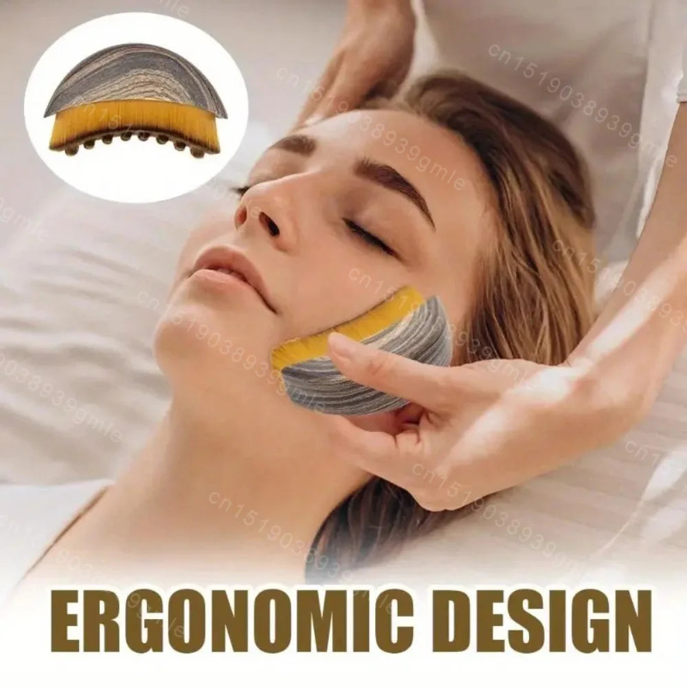Ergonomic wooden-patterned facial brush with soft yellow bristles being used to massage a woman’s jawline.