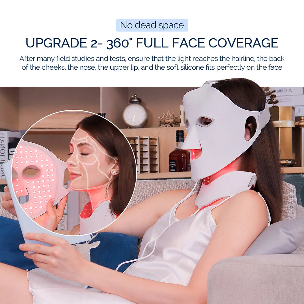 A woman wears a white, flexible silicone LED face and neck mask that emits red light for skin therapy.