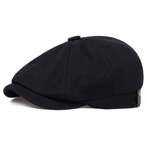 Tidesmit black cotton flat cap, a structured newsboy-style beret with a small side button detail.