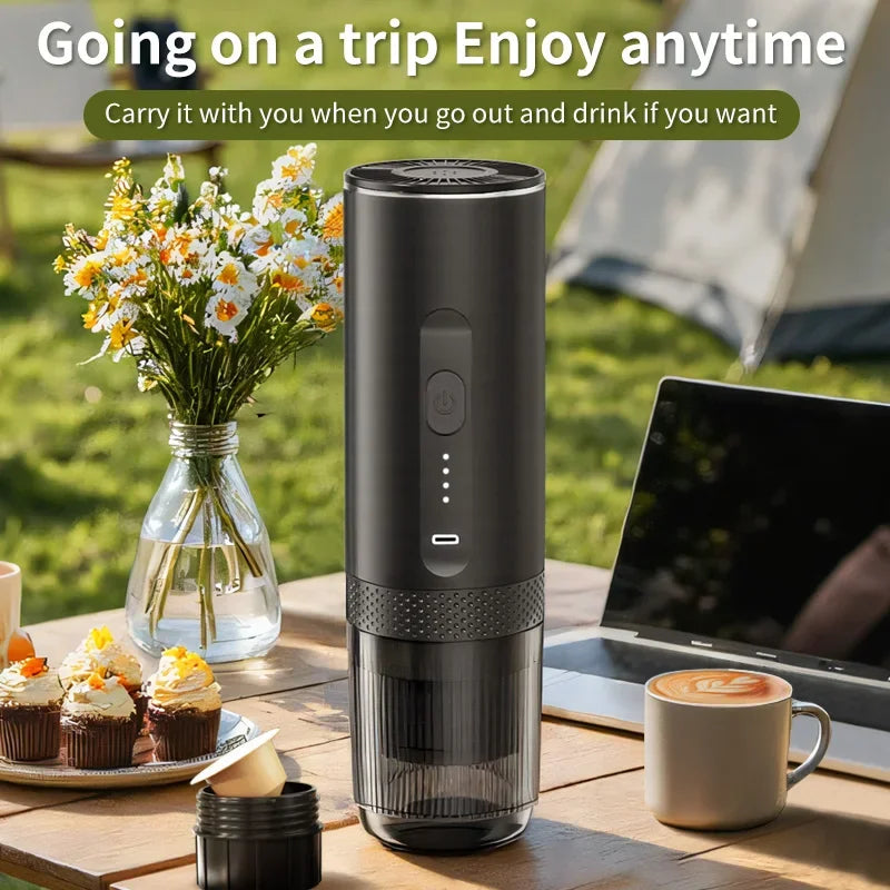 Black portable electric espresso coffee maker for travel, compact rechargeable design with transparent water reservoir.