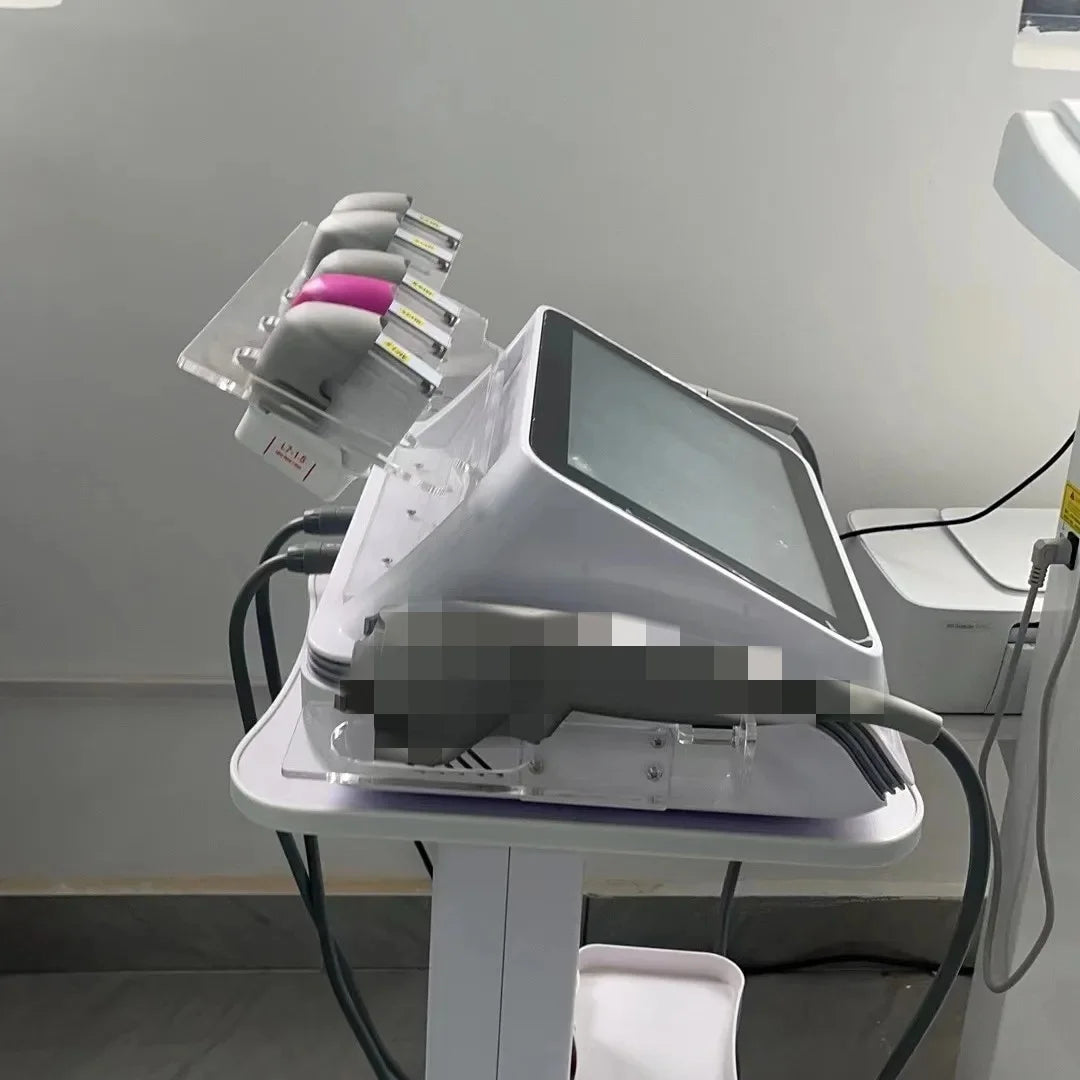 White 7D beauty spa machine with a touchscreen, applicator handpieces, and an acrylic rack on a white salon stand.