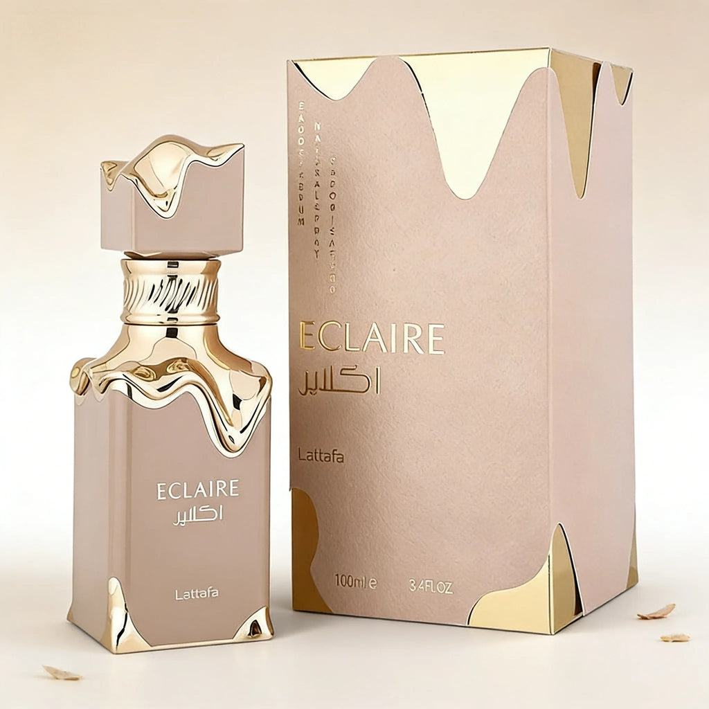 Lattafa Eclaire perfume bottle and box in beige and metallic gold, featuring a unique melted drip design.
