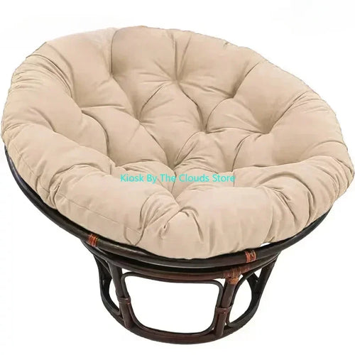 Beige round fabric meditation cushion for mindfulness and relaxation on a sturdy rattan frame.