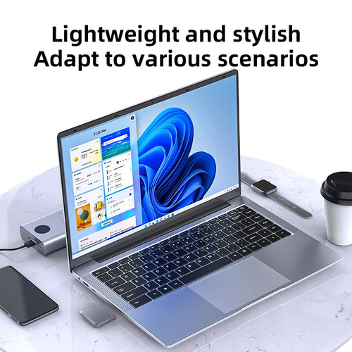 Silver 14.1-inch ultra-slim laptop showing Windows 11 desktop, thin-bezel display, and black backlit keyboard.