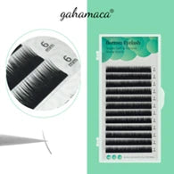 Tray of black 6mm bottom eyelash extensions, showing individual synthetic lashes held by tweezers.