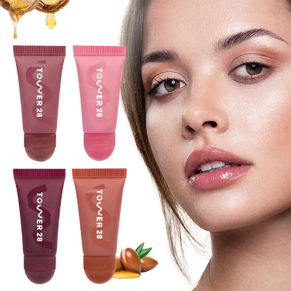 4pcs Tower 28 lip jelly set with hydrating mirror-shine tinted balms in assorted natural shades on a model.