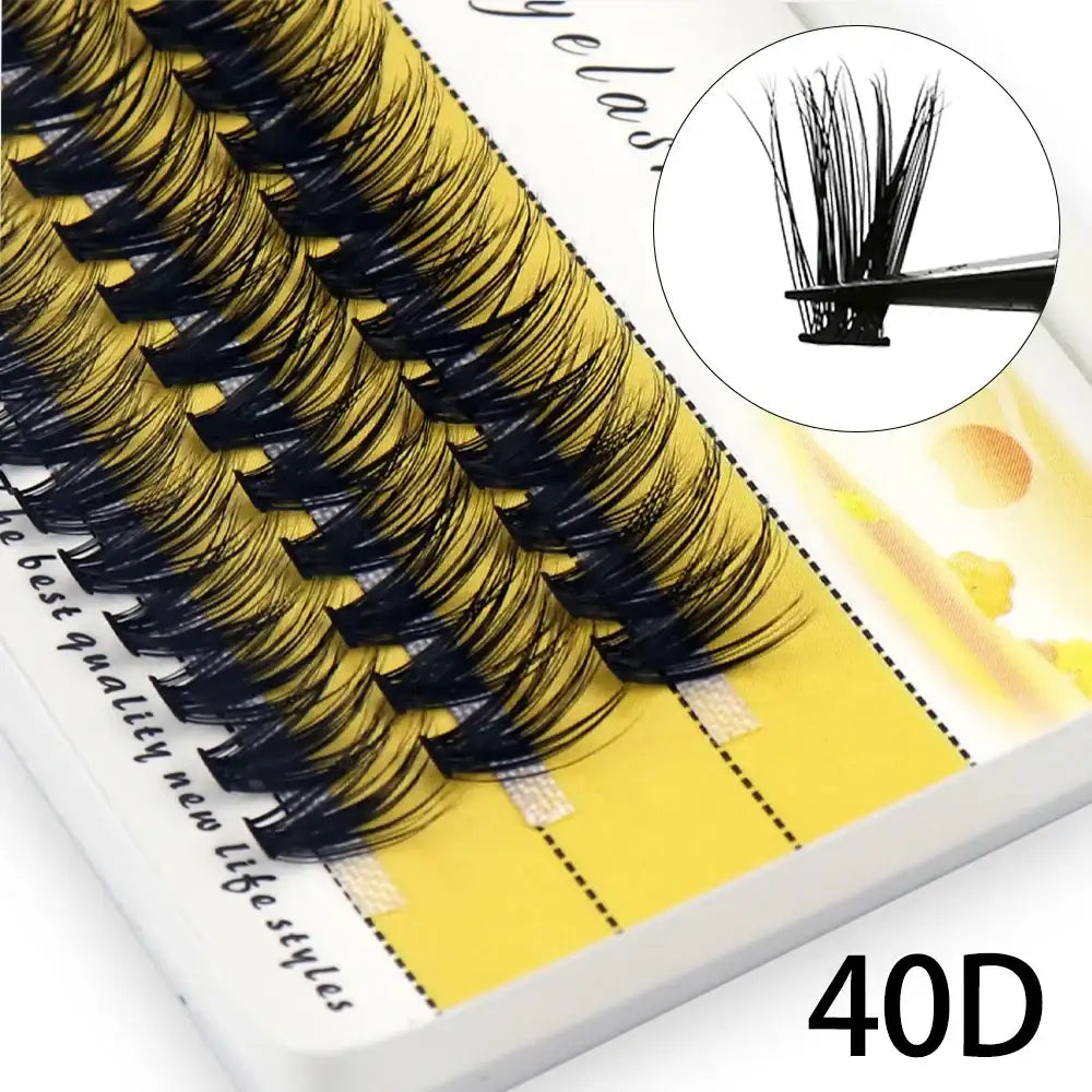 Box of 60 black individual 40D mink eyelash clusters on a yellow tray, with a zoomed-in view held by tweezers.