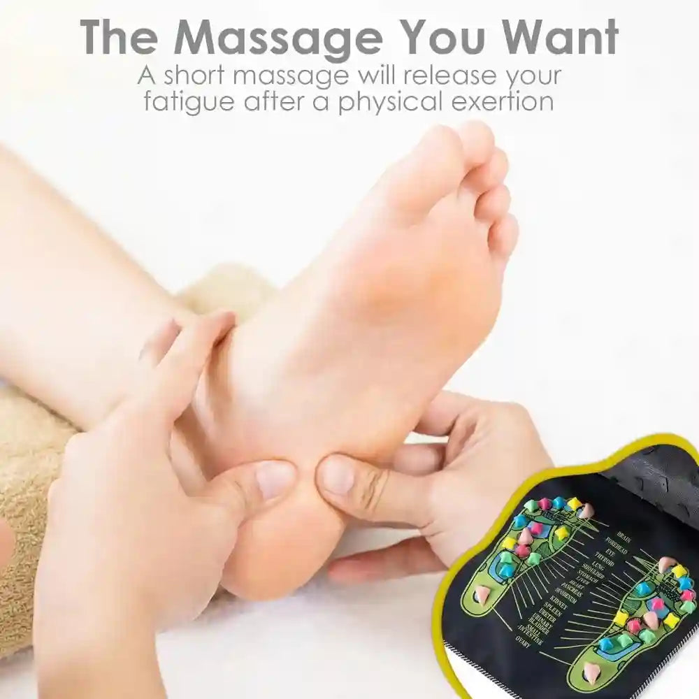 Person receiving foot massage with reflexology acupressure stone mat for pain relief and circulation at home.