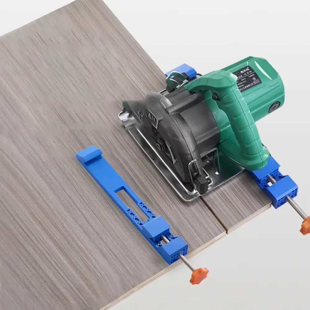Green circular saw mounted on blue edge guide clamps with orange adjustment knobs