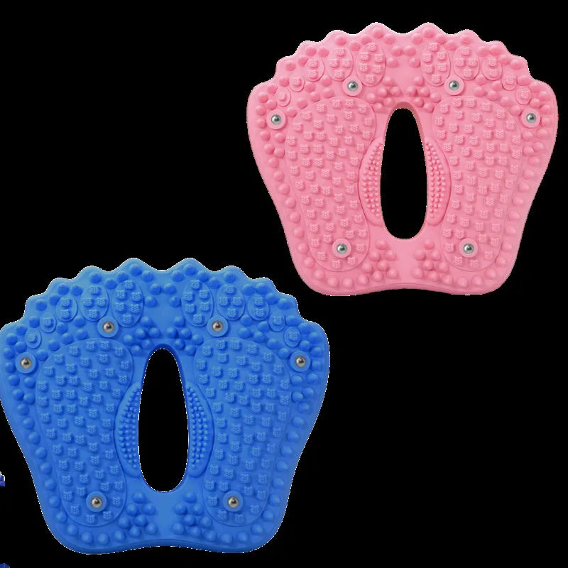 Pink and blue plastic foot-shaped acupressure massage pads with textured nubs and magnetic points for reflexology.