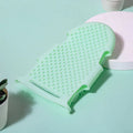 Mint green silicone pet bath glove and massage brush for gentle cleaning and shedding removal.