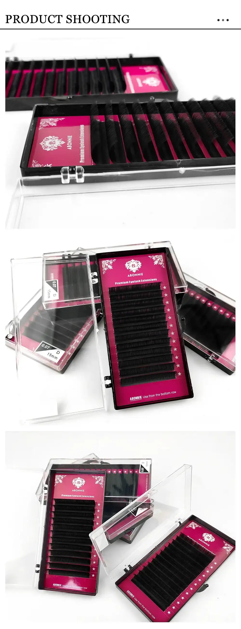 Black individual eyelash extension strips in clear plastic storage cases with pink backing cards for beauty application.