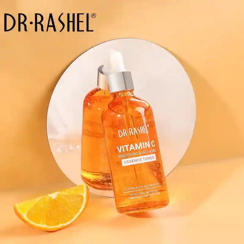 DR.Rashel Vitamin C Essence Toner in clear orange bottle for skin brightening, revitalizing, and anti-aging face care.
