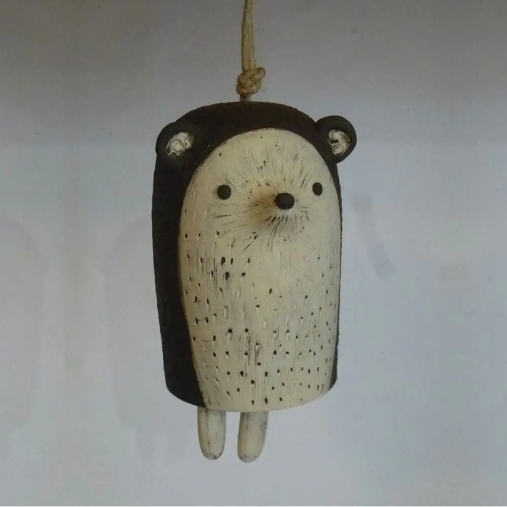 Cute hedgehog resin wind chime for rustic garden decor. A charming, handcrafted animal bell for outdoor hanging gifts.