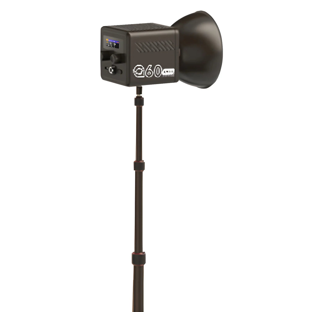 Black G60 studio LED light with reflector mounted on a telescopic metal tripod stand for photography and video lighting.