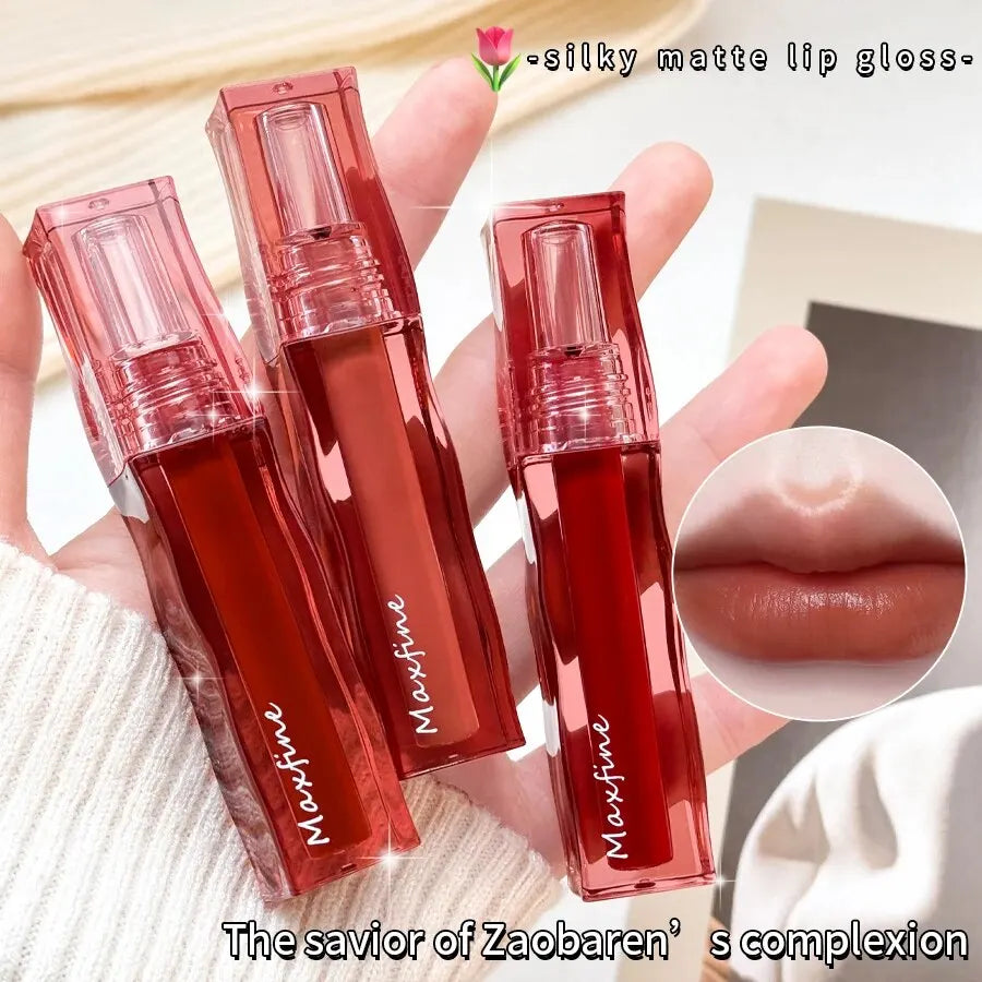 Highly pigmented, moisturizing liquid lipstick with a silky matte finish in a square, transparent red tube.