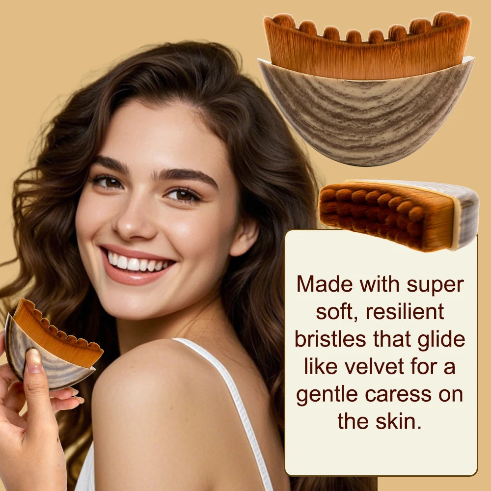 A smiling woman holds a curved, wooden-patterned lymphatic face brush with soft, brown scalloped bristles.