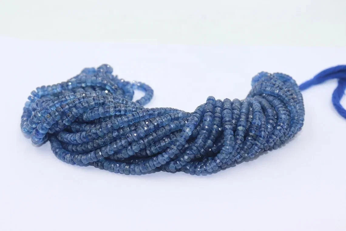 Kyanite rondelle bead strand, faceted blue beads, looped coil with visible drilled holes